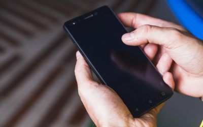 from-hand-using-smartphone-scaled.jpg - ReactiveNews