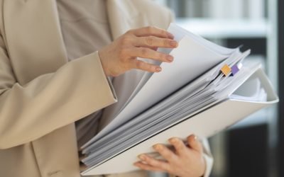 young-adult-organizing-documents.jpg - ReactiveNews