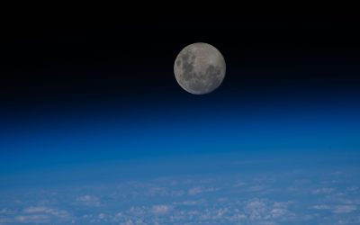 iss070e047294 (Dec. 26, 2023) -- The last full moon of 2023, the "Cold Moon," sits just above the blue glow of Earth's horizon as the International Space Station orbited nearly 270 miles over the Pacific Ocean.
